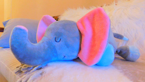 Elefootprints-light-and-sound-plush-elephant-side view