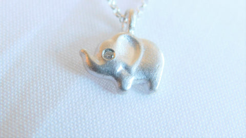 Elefootprints sterling silver baby elephant necklace with diamond eye