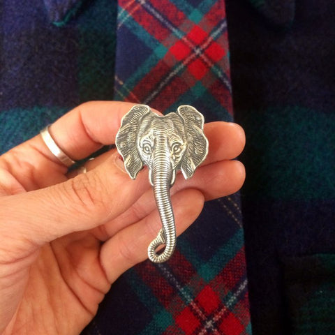 elefootprints- Elephant tie tack lapel pin on hand