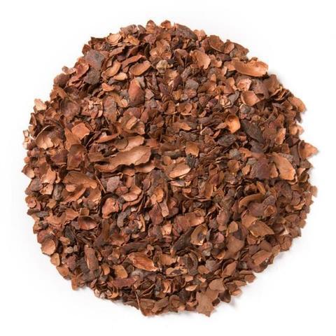 cacao husks formed into a circle flatlay white background