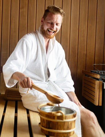 Man Smiling Inside a Sauna