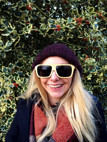 Cute girl wearing all wood sunglasses