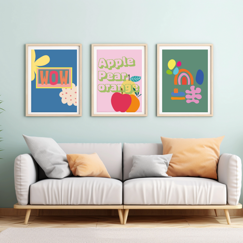 a framed colourful abstracted design wall prints hanging a above a sofa placed against a wall