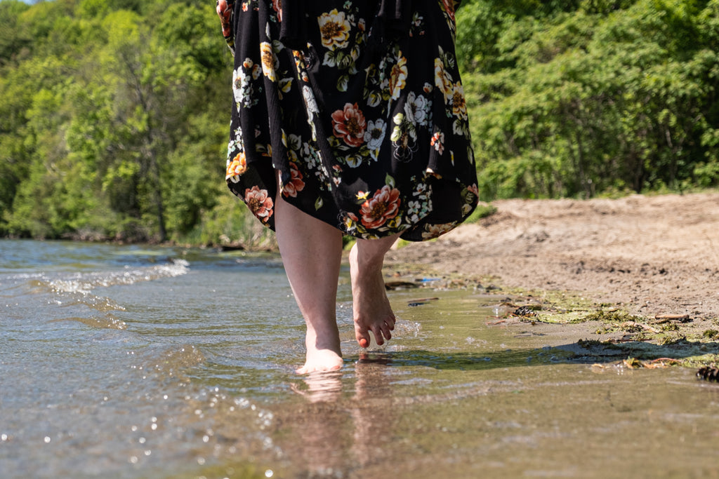 earthing on sandy beach lake barefoot healing