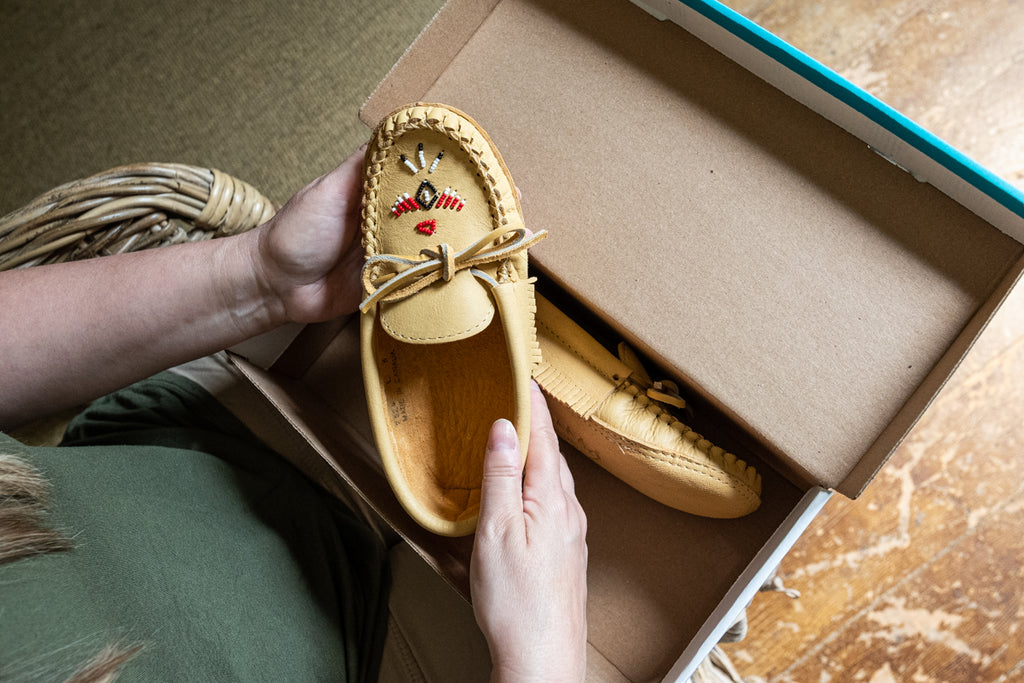 unboxing a pair of Laurentian Chief moccasins for women