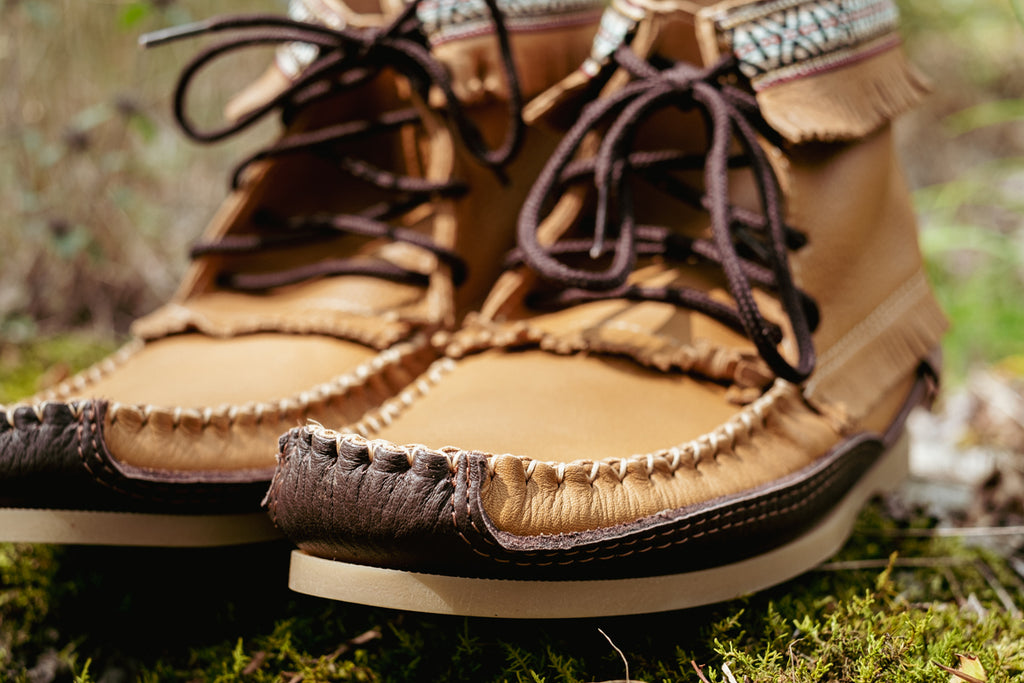 close up of hand-stitching on quality moccasin boots