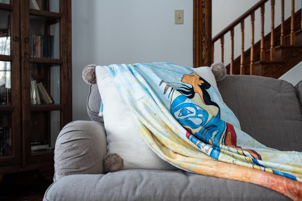 Beautiful Native American artwork on a cozy throw blanket on a sofa Maxine Noel
