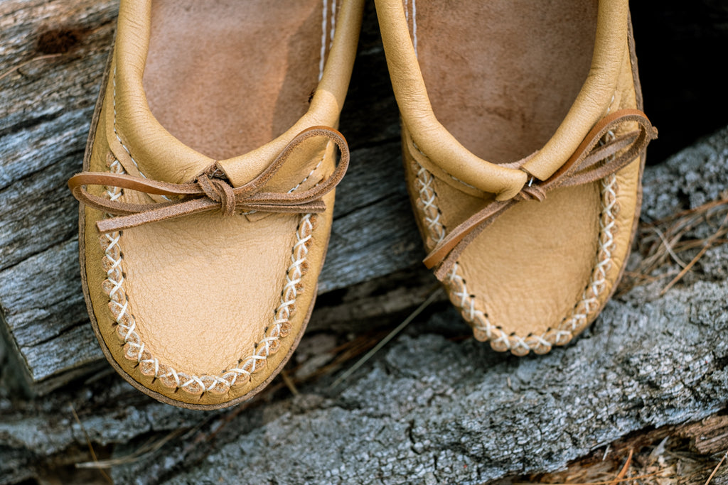 Rawhide laces and ballet style moccasins made from moose hide leather