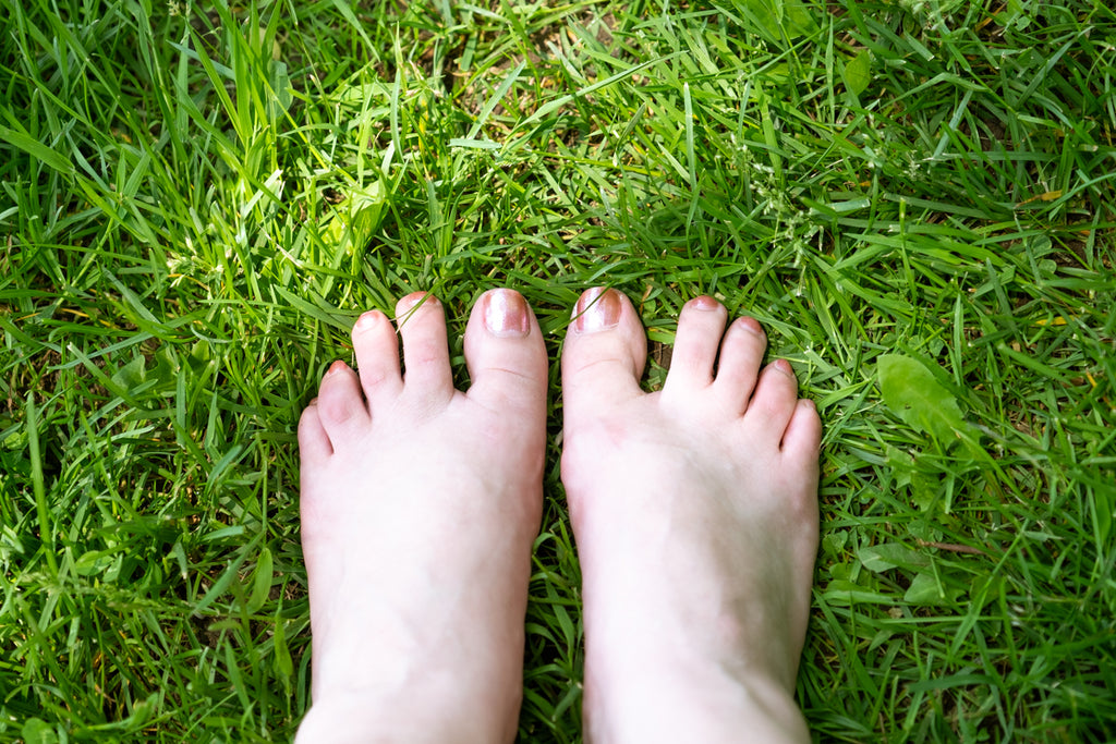 earthing going barefoot in the grass