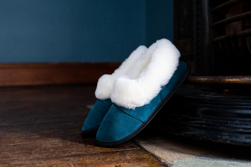 deep aqua colored sheepskin slippers by garneau made in quebec canada