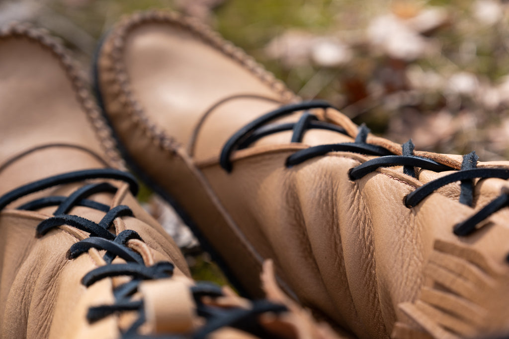 close-up of genuine moose hide leather lace up moccasin boots