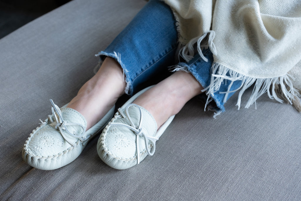 Cooler fall weather brings on cozy blankets and comfy warm white moccasin slippers