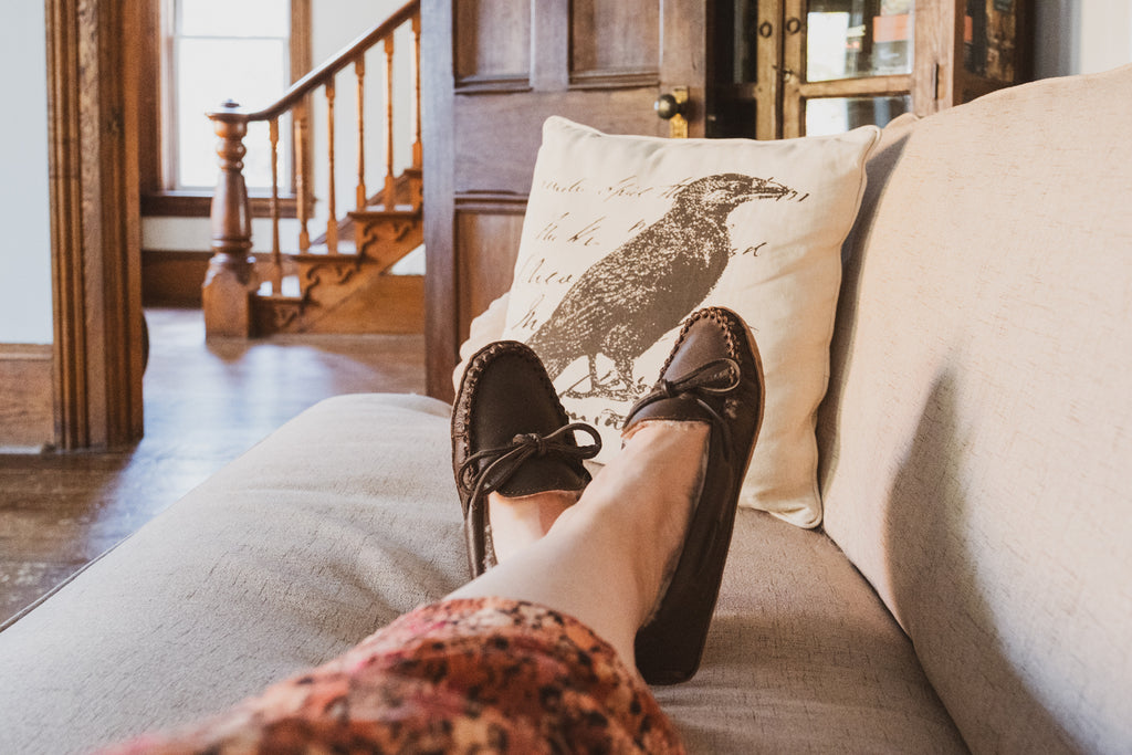 Laurentian Chief makes sheepskin-lined moccasin slippers in deep chocolate brown