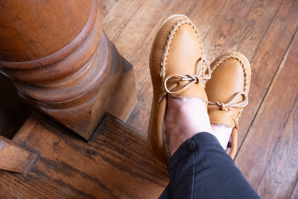 Wearing a pair of Canadian made quality genuine leather lined moccasin slippers