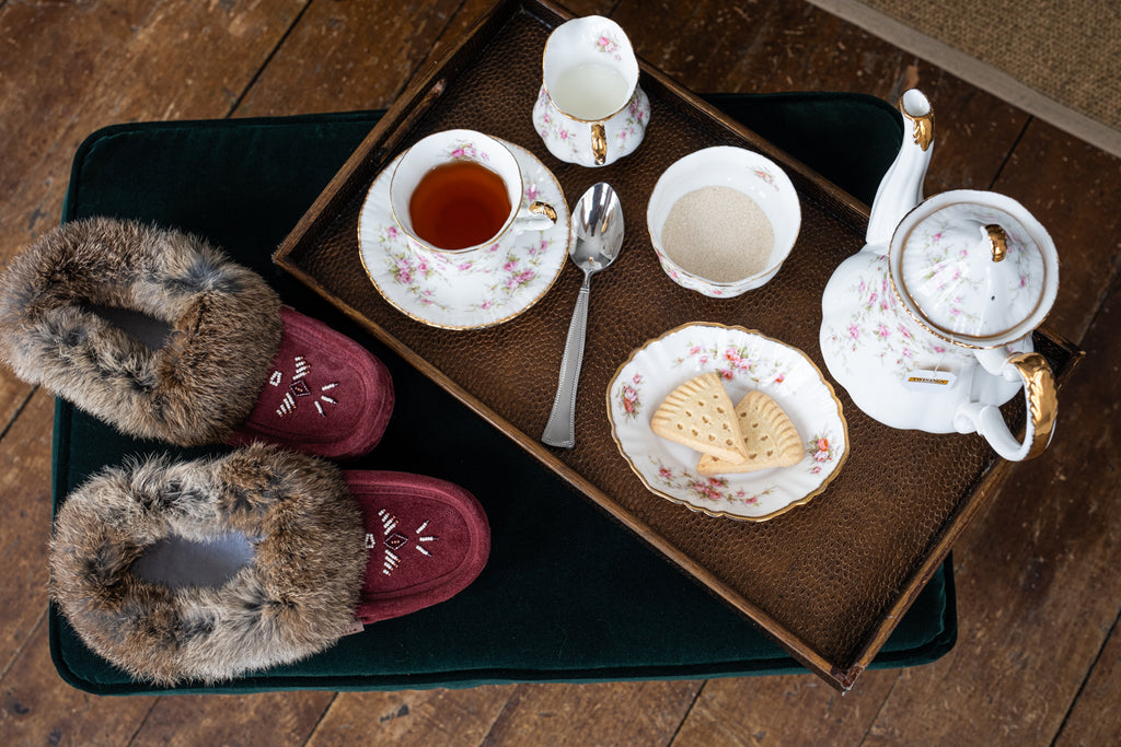 Cup of tea and cozy slippers