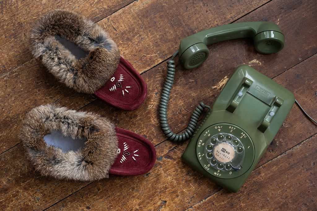 Old Fashion phone and old fashion moccasin slippers