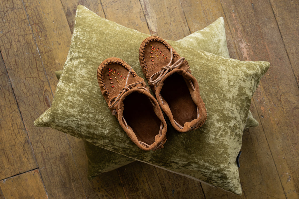 Canadian handmade moccasins crafted by Laurentian Chief from genuine suede with many fashionable features.