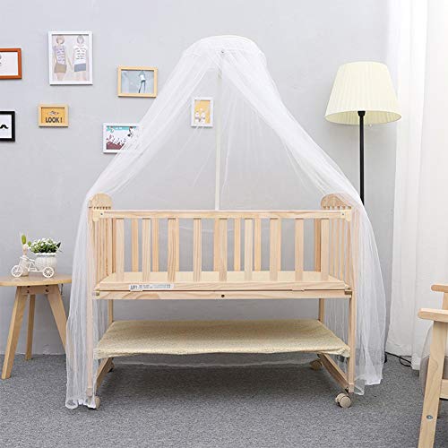 wooden cot with mosquito net