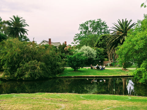 Fitzroy Gardens in East Melbourne, Australia with view to lake and Captain Cook Cottage in the background