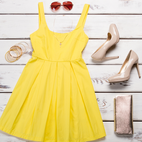 Yellow summer dress, ladies nude high heels and sequin purse