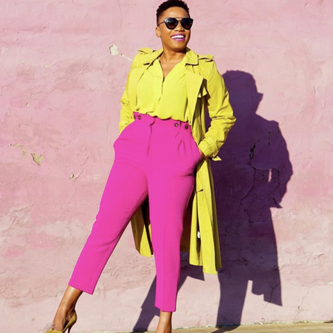 Lady wearing pink trousers and canary yellow coat