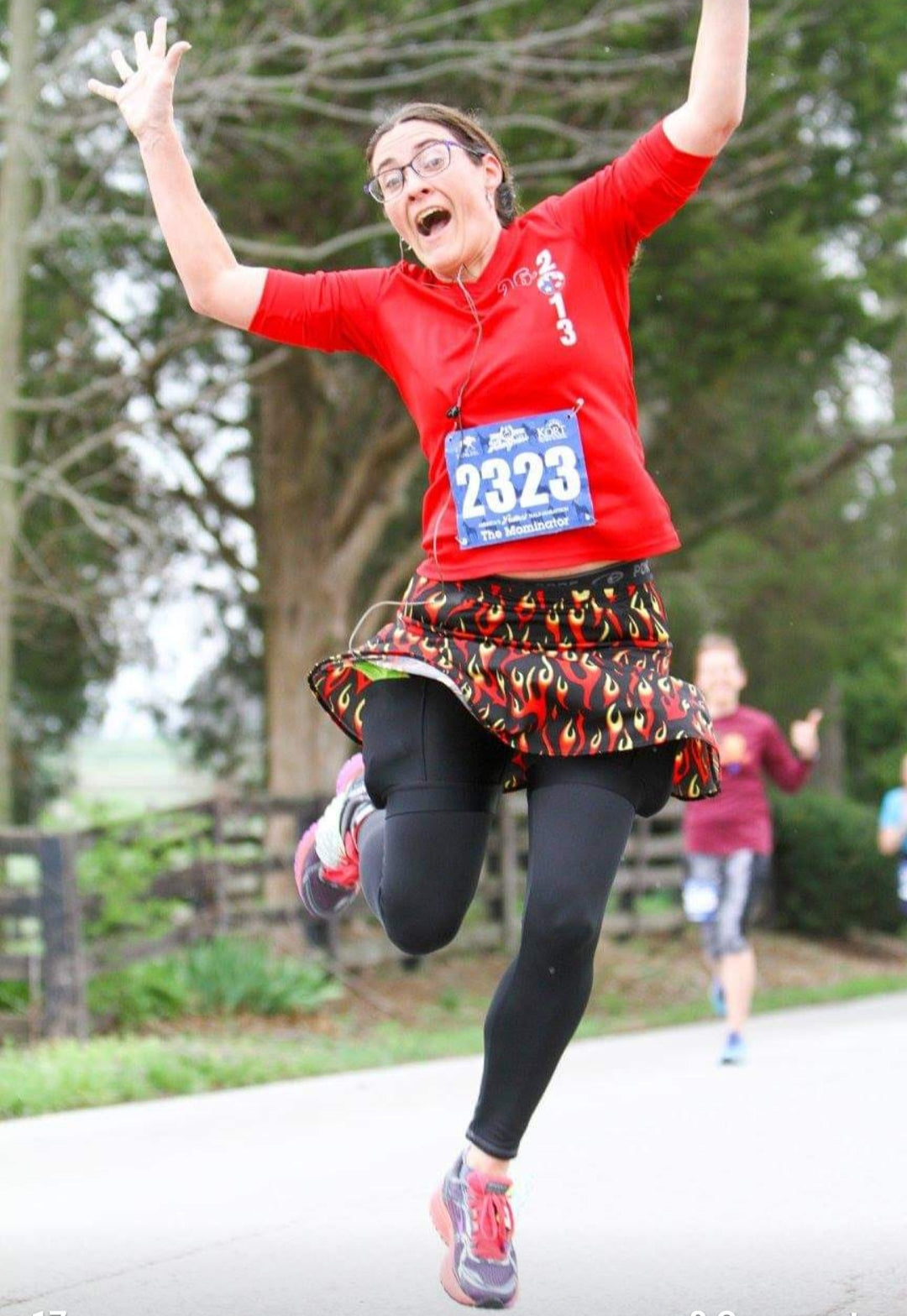 Melissa Marowelli jumping in a race wearing a Bolder Athletic Wear skirt