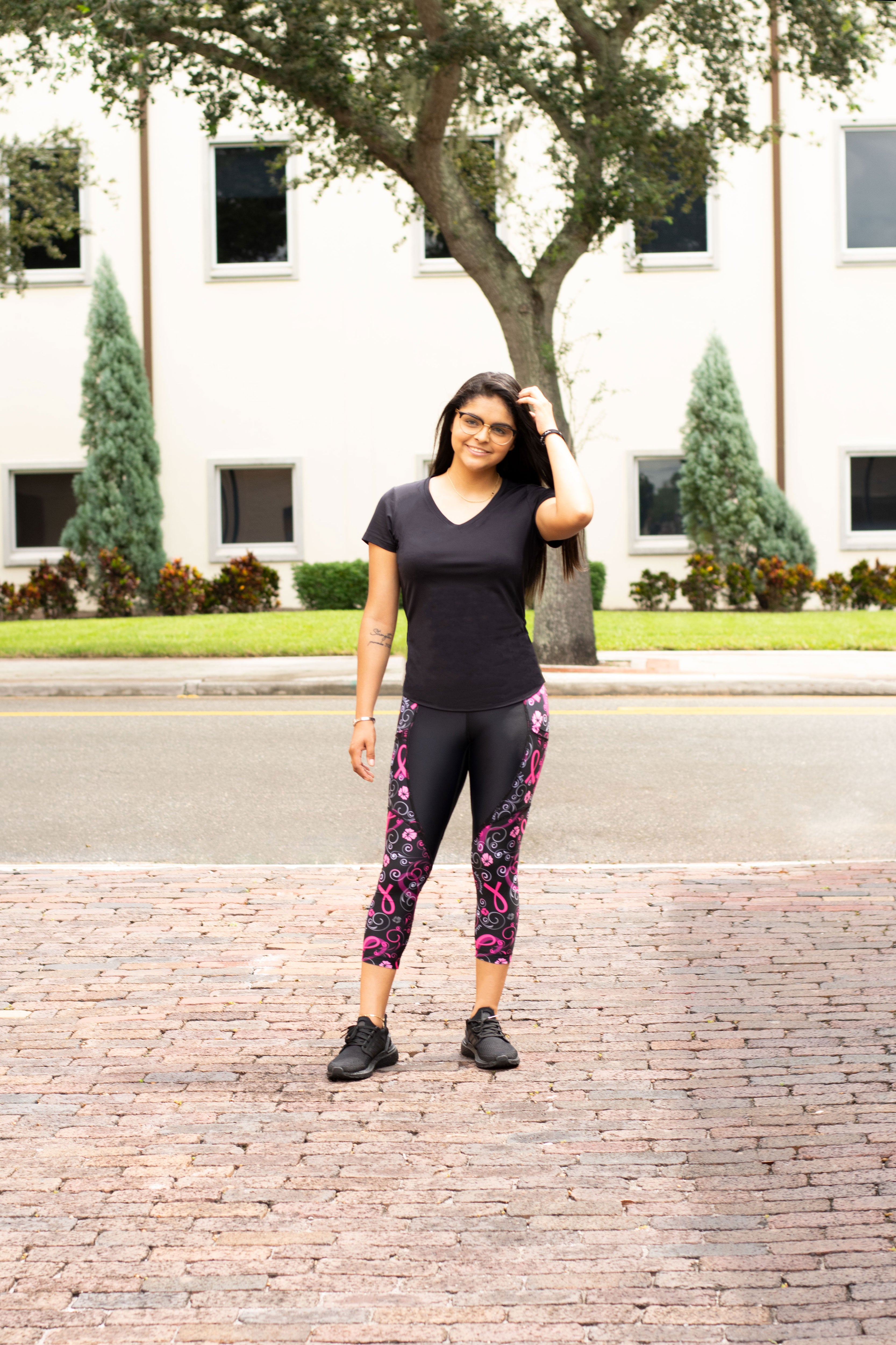 Model in front of street wearing Thrive capris