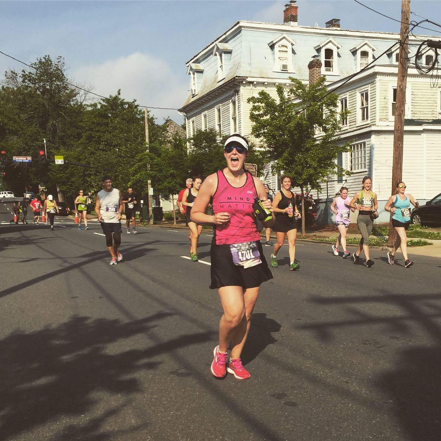 Chrissy running a race in a Bolder skirt