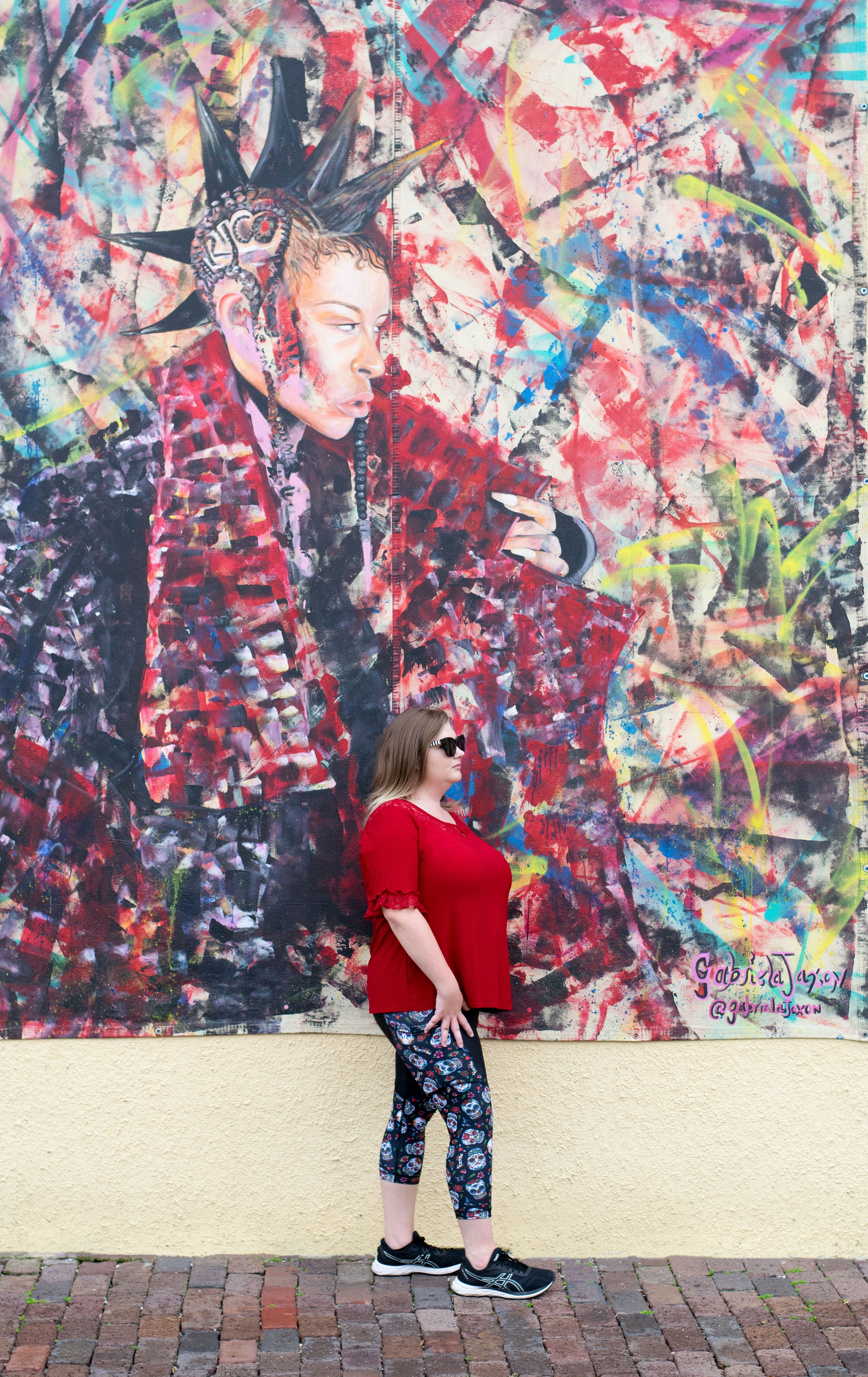 Model against wall art wearing Frida capris