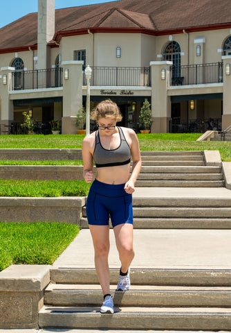 Model pictured wearing navy BOLDER endurance shorts