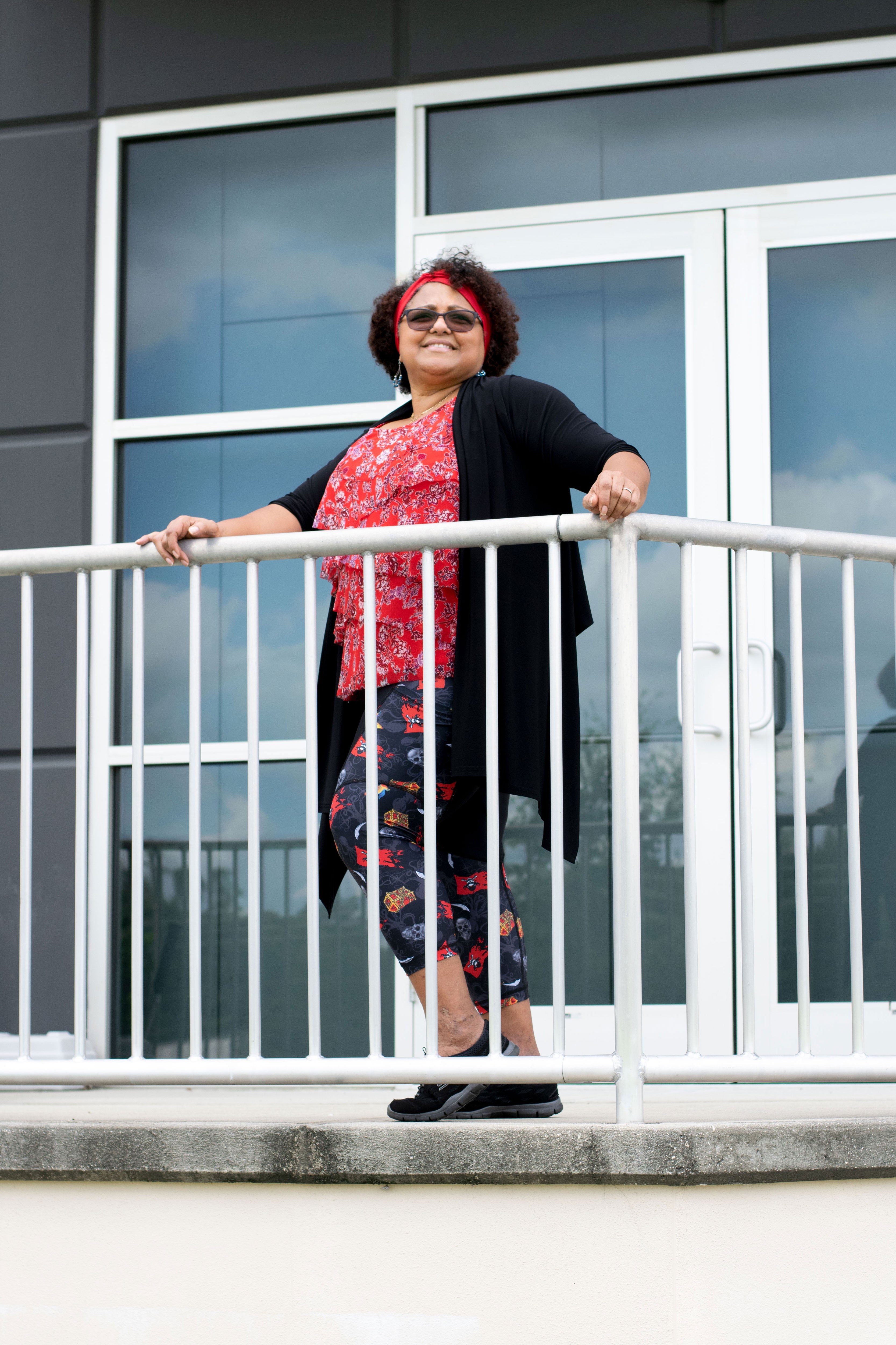 Model behind railing wearing Gaspar capris