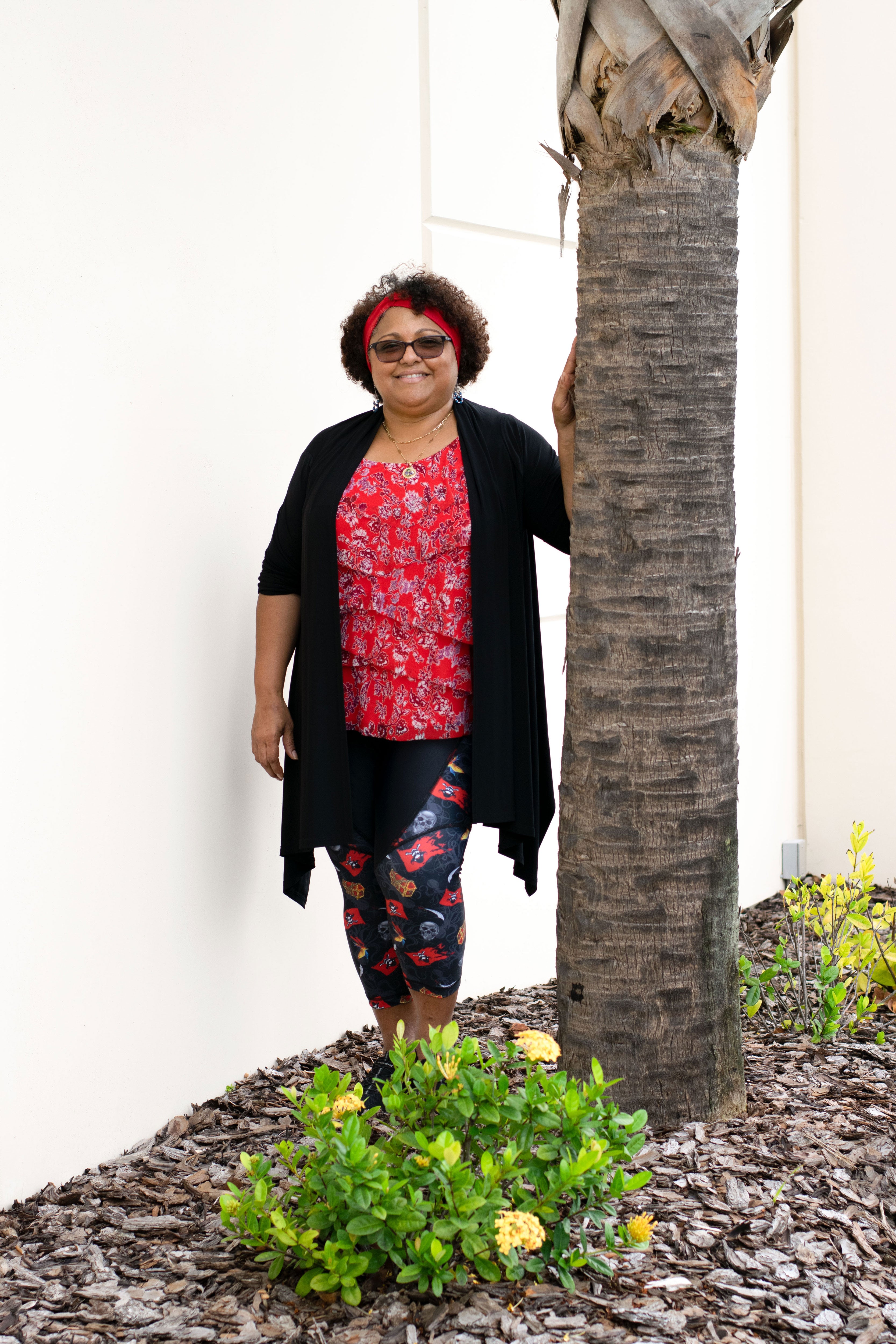 Model leaning against tree wearing Gaspar capris