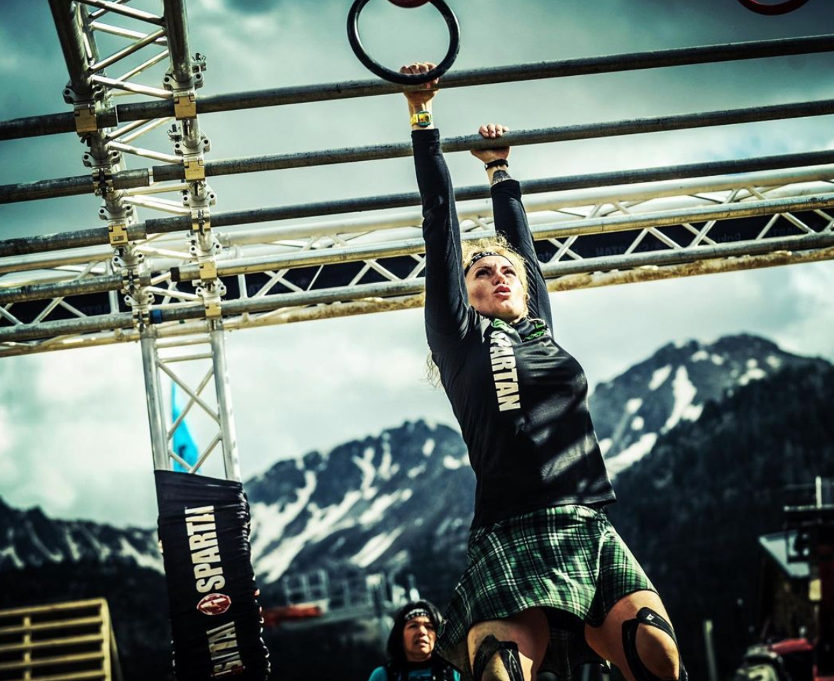 Samantha on monkey bars wearing a Bolder skirt