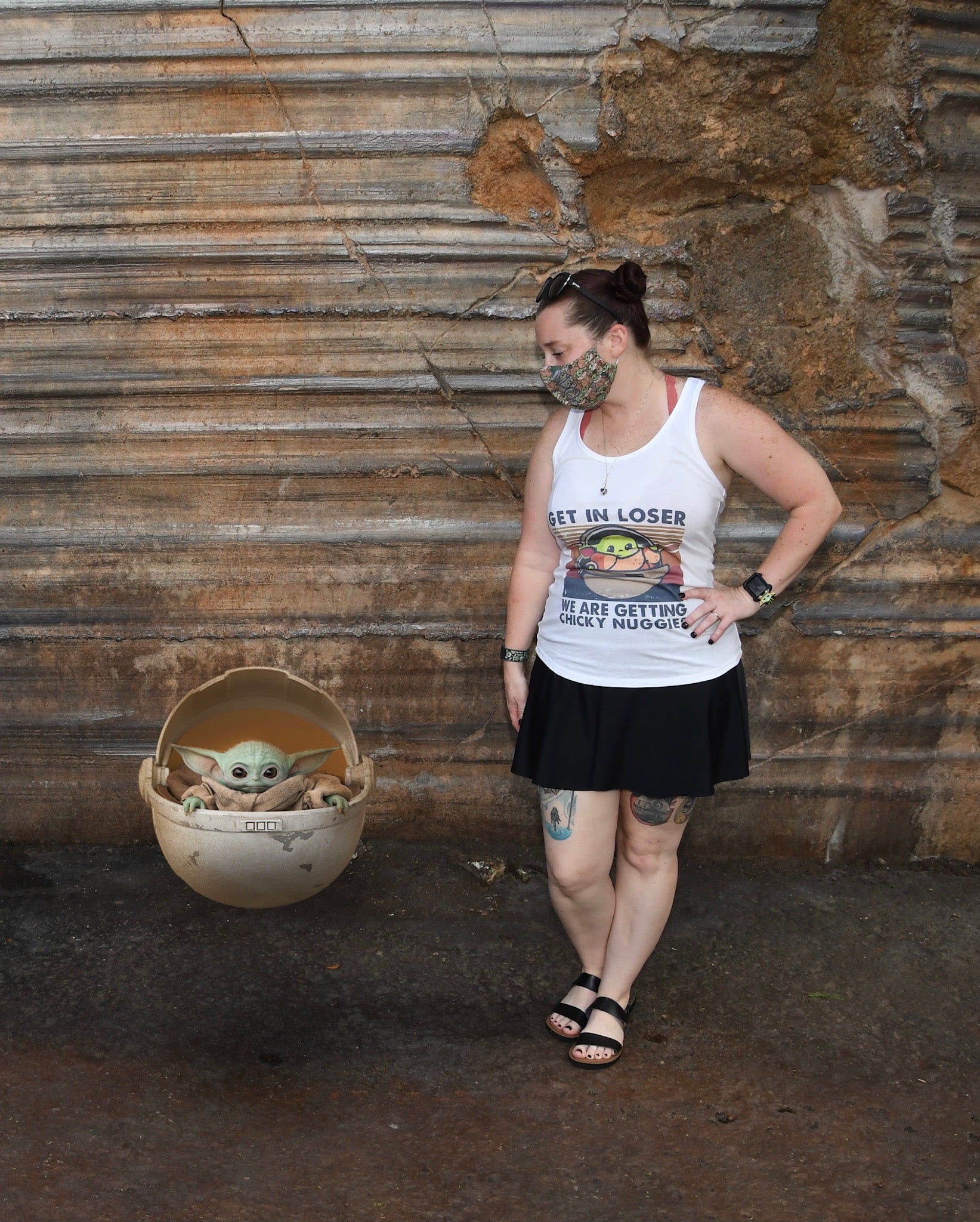 Becky posing with Baby Yoda while wearing a Bolder skirt