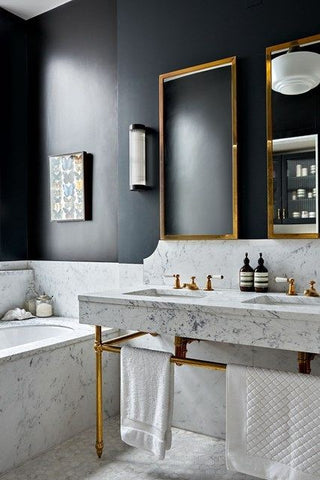 A traditional classic interior bathroom with brass finishes