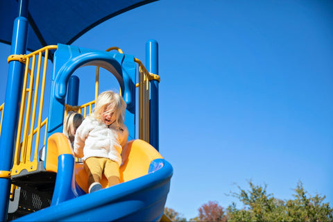Girl on Playground Slide