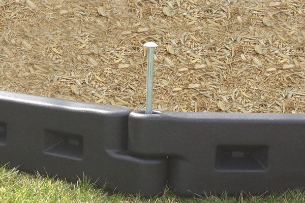 Non-synthetic engineered wood fiber playground surfacing made from loose fill material