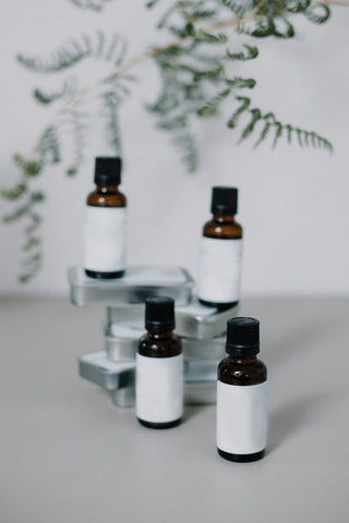 amber glass essential oil bottles with white labels