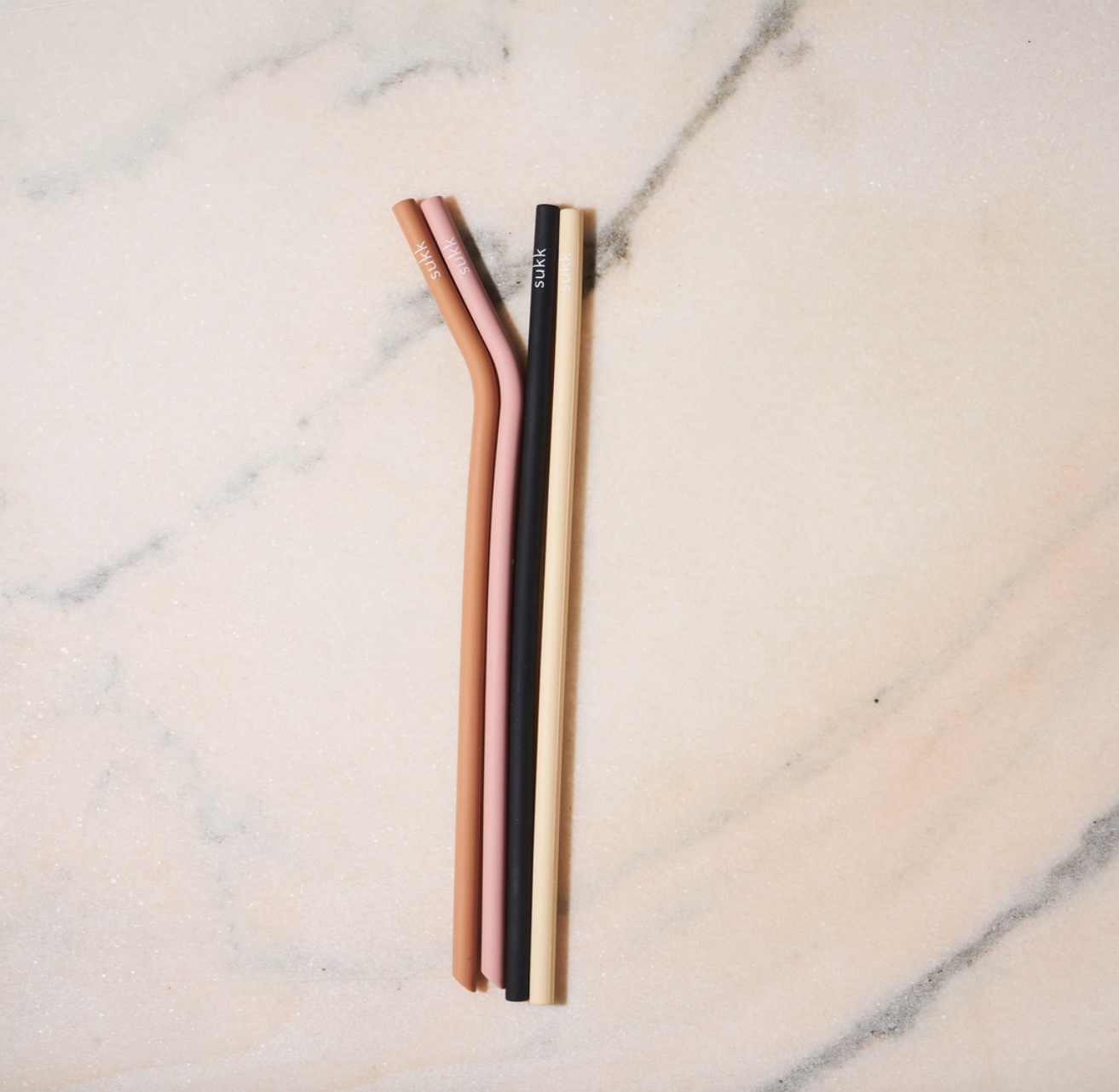 https://cdn.shopify.com/s/files/1/0101/0142/products/Sukk-reusablesiliconestraws-setof4-coolcolors-soldbybyGoodsthatMatter4.png?v=1619057383