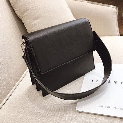 wide strap crossbody bag designer