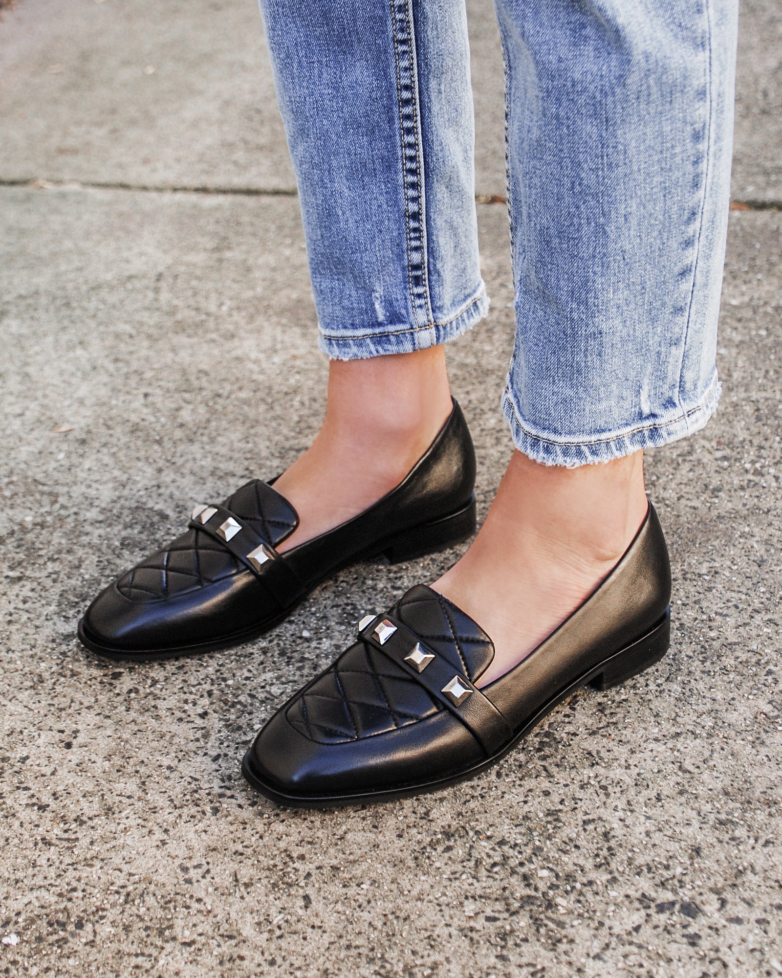 black quilted loafers