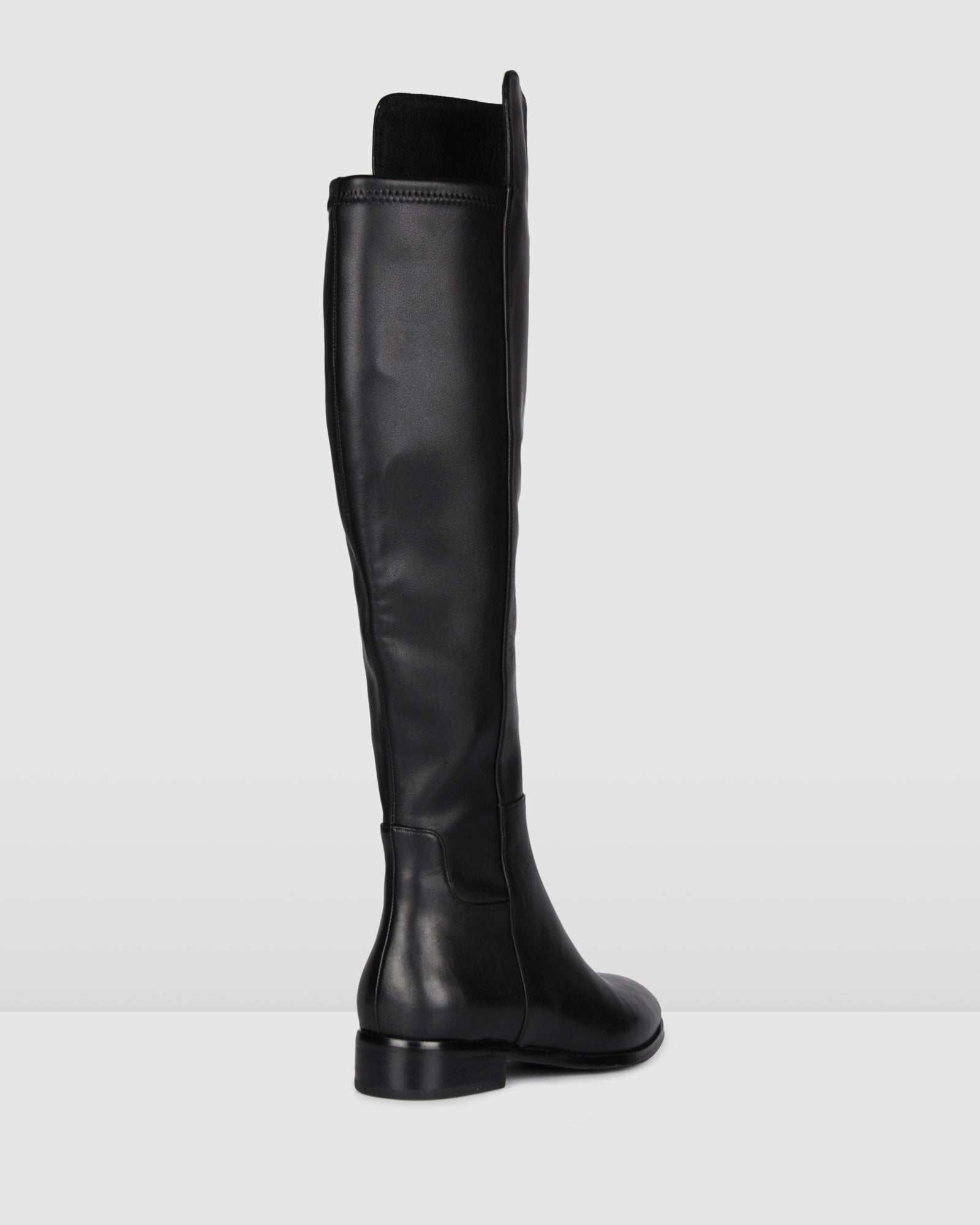 black flat over the knee high boots