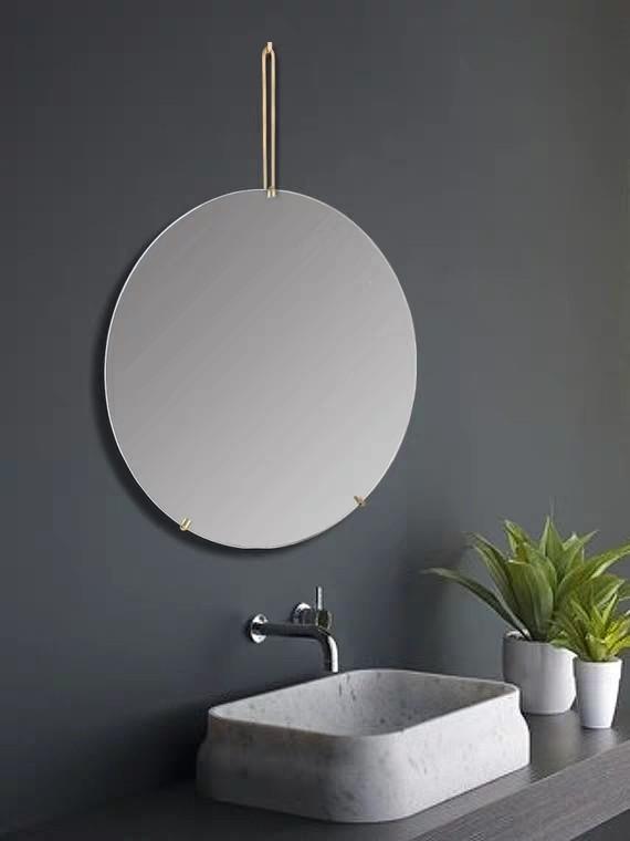 hanging a round mirror on the wall