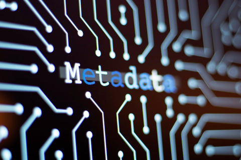 A digital screen with word "metada" in blue and white font