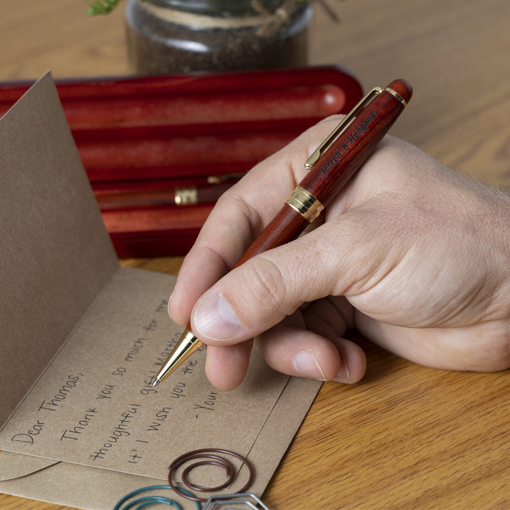 Rosewood Ballpoint Pen with Medical Engraving on Case writing a thank you letter