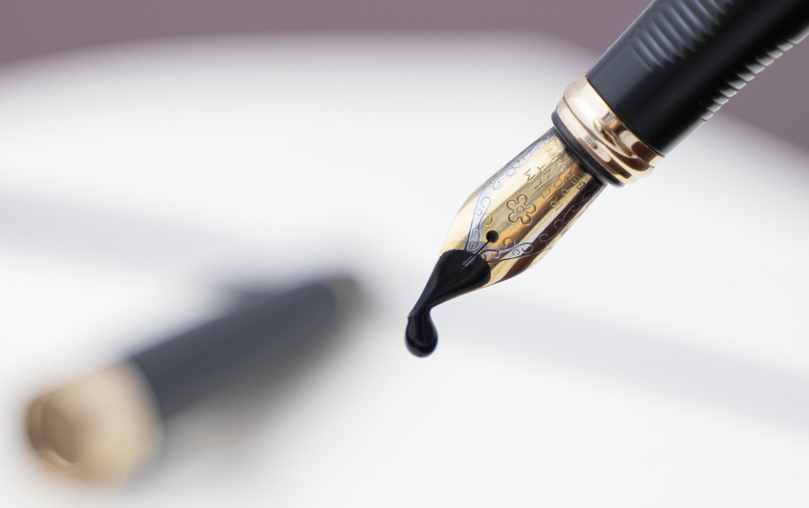 Drip of Ink Falling Out of a Fountain Pen