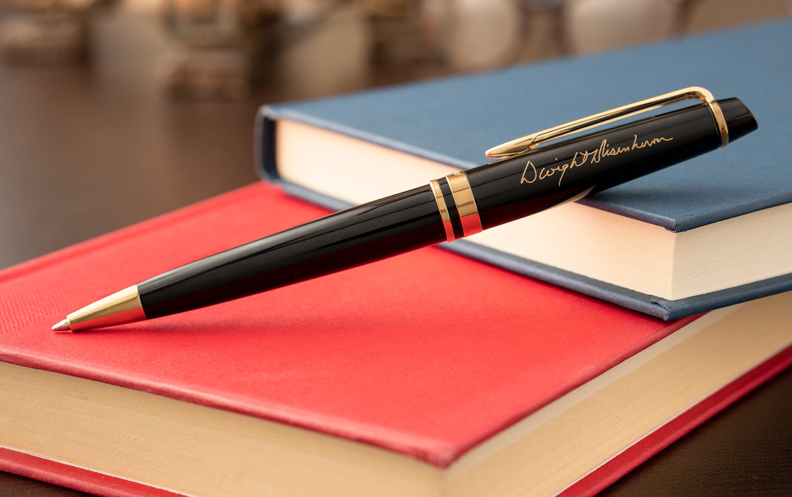 Waterman Expert Ballpoint pen propped on journals
