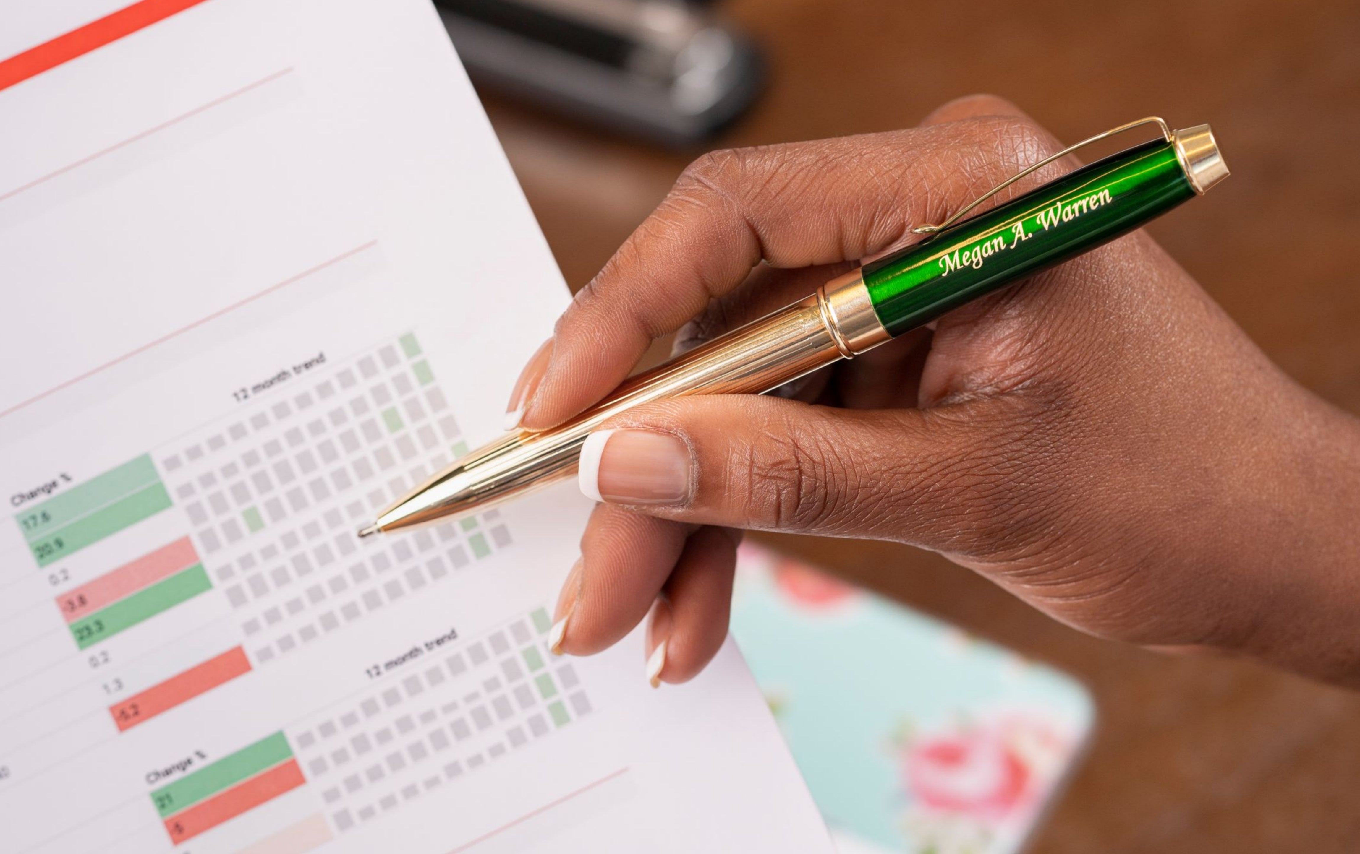 woman holding engraved Braxton Green ballpoint pen