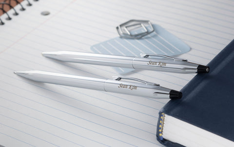 engraved Classic Century Chrome Set next to desk items