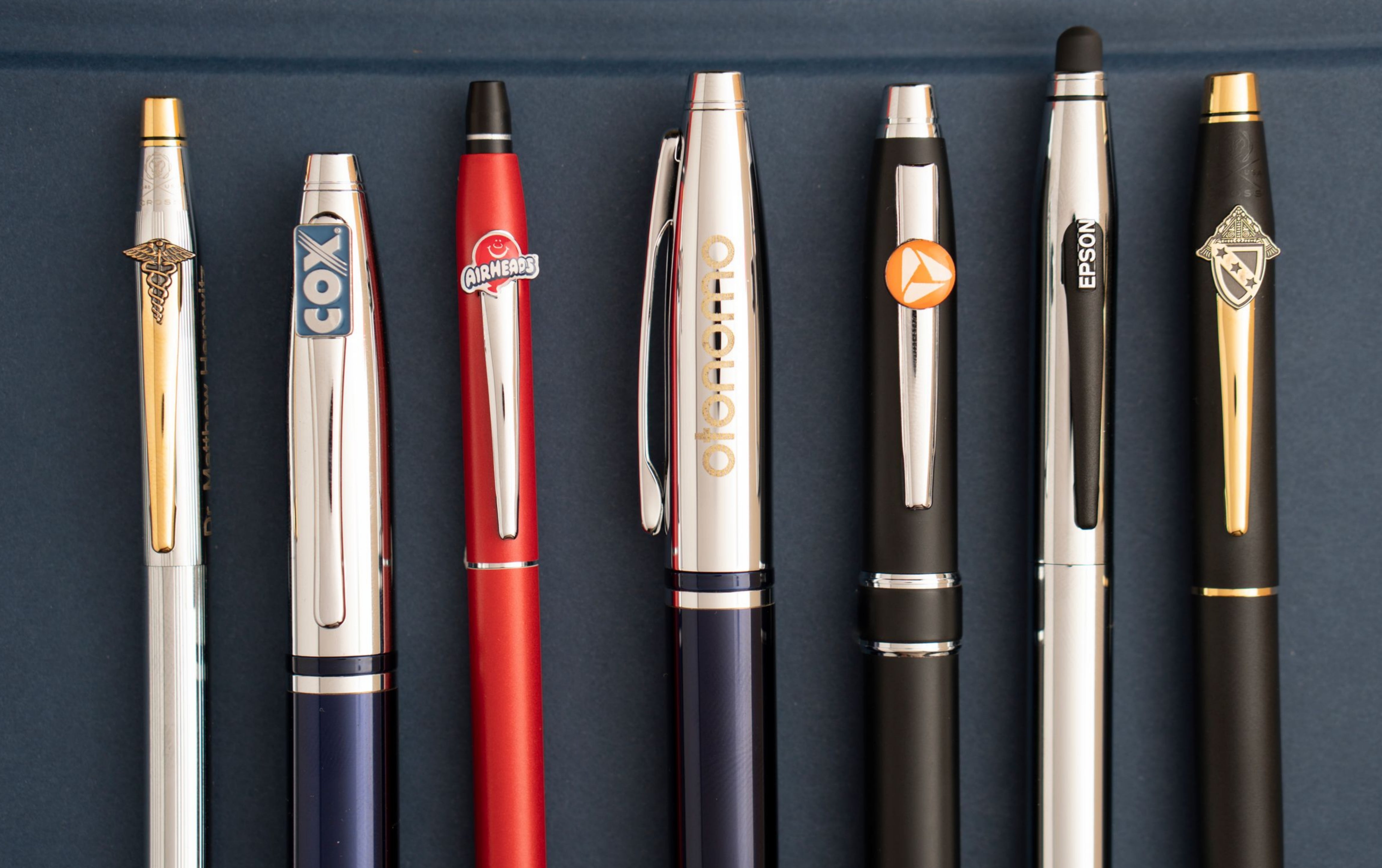 Multiple Engraved Pens with company logos displayed